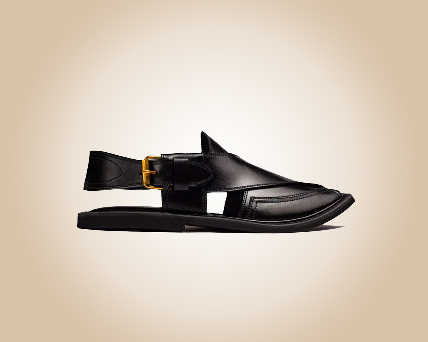 A pair of classic black Saplay sandals, known as Peshawari Chappal, with intricate leatherwork.