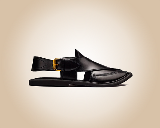A pair of classic black Saplay sandals, known as Peshawari Chappal, with intricate leatherwork.